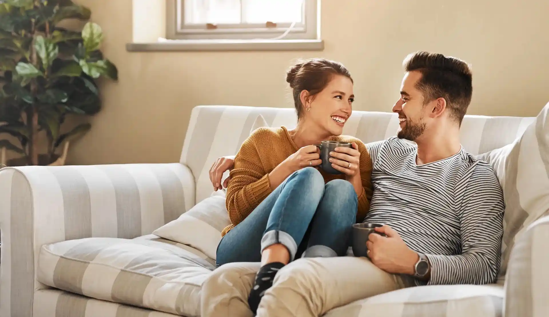 Happy couple on sofa